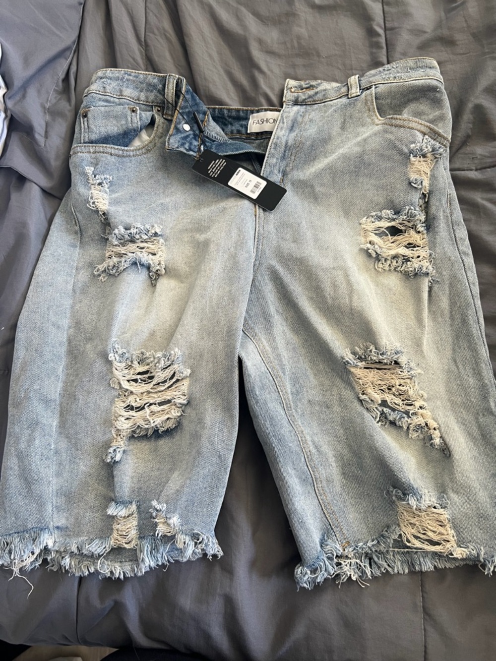 Fashion Nova Light Wash Distressed Denim Capris